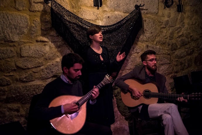 Fado singer performing in a typical casa de fado in Alfama, Lisbon
