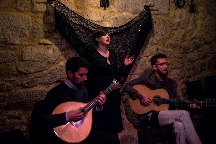 Fado singer with guitarists in Lisbon, Portugal