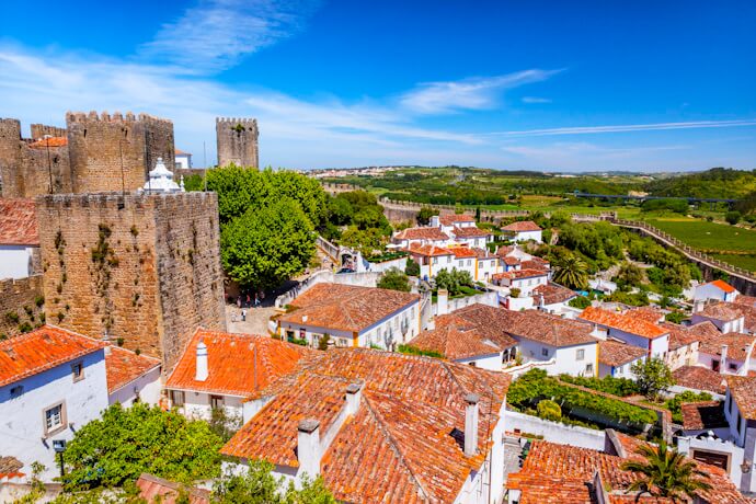 Medieval Óbidos Castle overlooking the whitewashed houses and red rooftops of Óbidos, Portugal