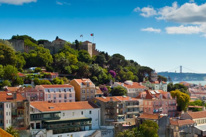 São Jorge Castle overlooking the colorful rooftops of Lisbon, Portugal.