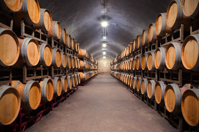 Rows of oak barrels age the region’s prized Port wine deep within the cellars of Vila Nova de Gaia.