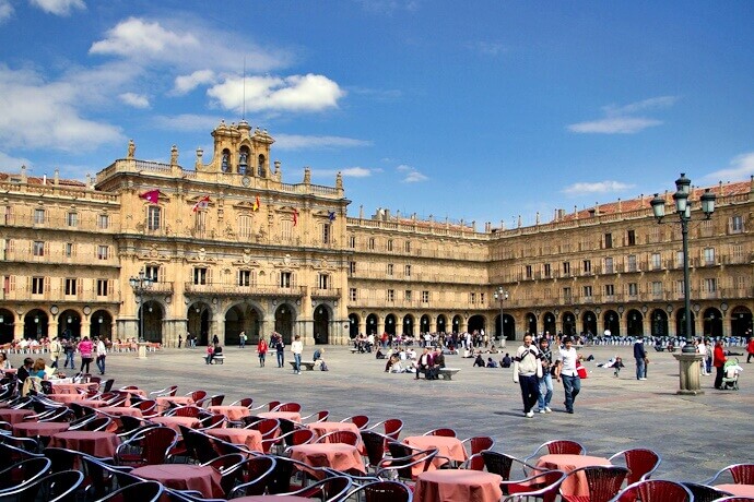 Plaza Mayor in Salamanca, Spain, with outdoor café seating and historic arcaded buildings