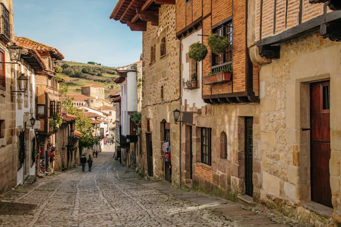 Cobblestone street lined with traditional buildings in Santillana del Mar