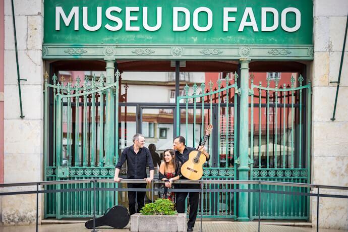 Portuguese guitar players and fado singer in front of Fado Museum in Lisbon
