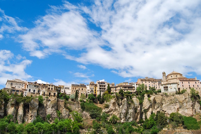 Houses perched on the cliffs of the Huécar Gorge, in Cuenca, Spain