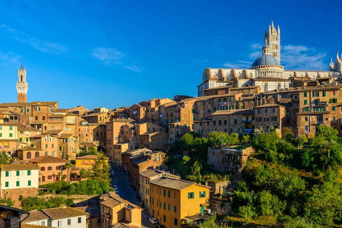Panoramic view of Siena's historic center with the Siena Cathedral rising above medieval rooftops