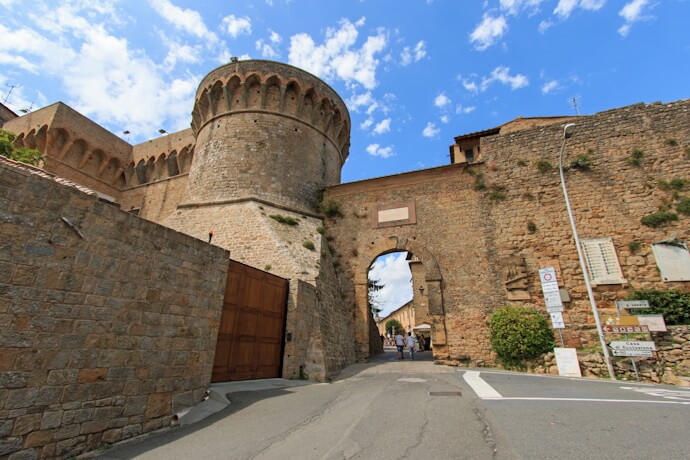 Pass through the emblematic Porta allArco in Volterra