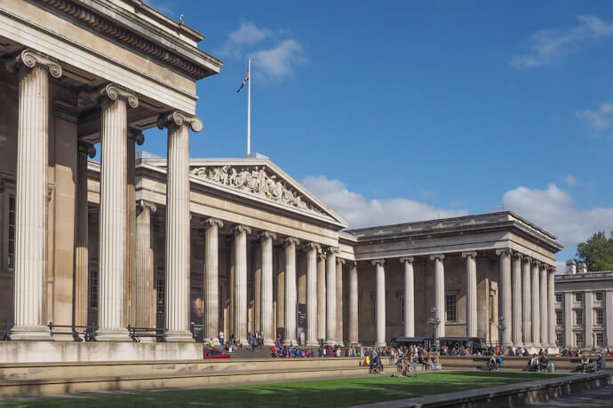 Tourists taking a short rest outside the British Museum