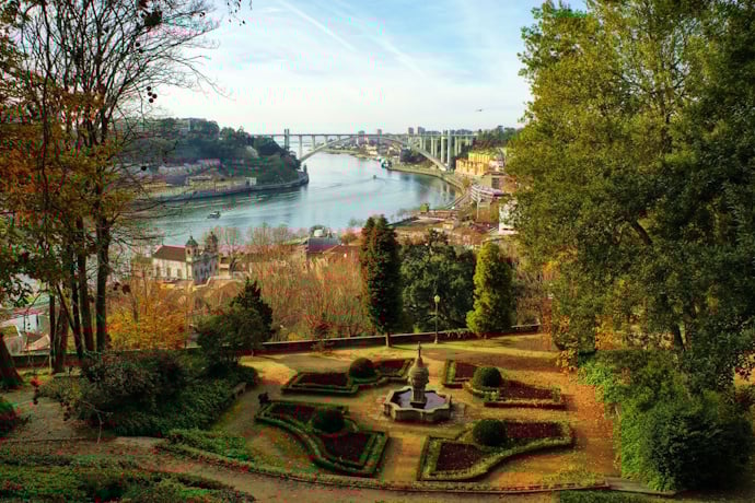 Crystal Palace gardens with river views, framing Porto and Vila Nova de Gaia beyond.