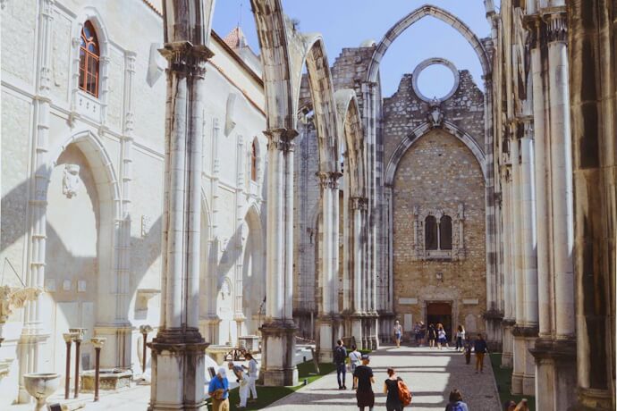 People visiting the Gothic Carmo Convent in Lisbon, Portugal