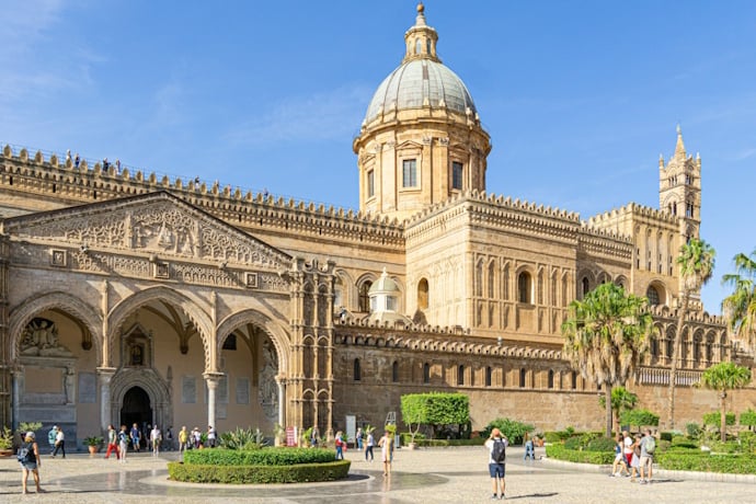 Tourists visiting Palermo Cathedral in a beautiful summer day
