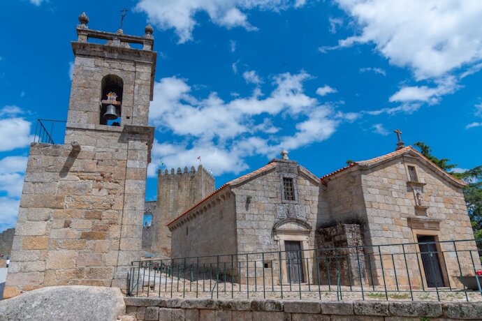 Belmonte featuring a stone church and a bell tower.