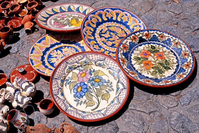 Colorful Portuguese ceramics displayed at a local market.