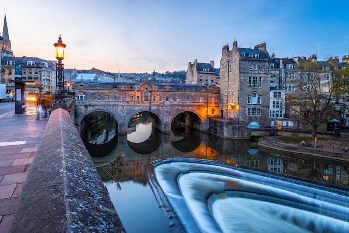 View of Pulteney Bridge over the River Avon in Bath, captured at dusk