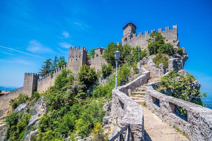 Medieval fortress rising above the rocky slopes of San Marino.