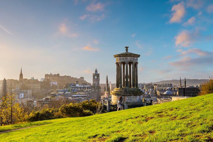 View from Calton Hill in Edinburgh, Scotland, overlooking the city skyline at sunset