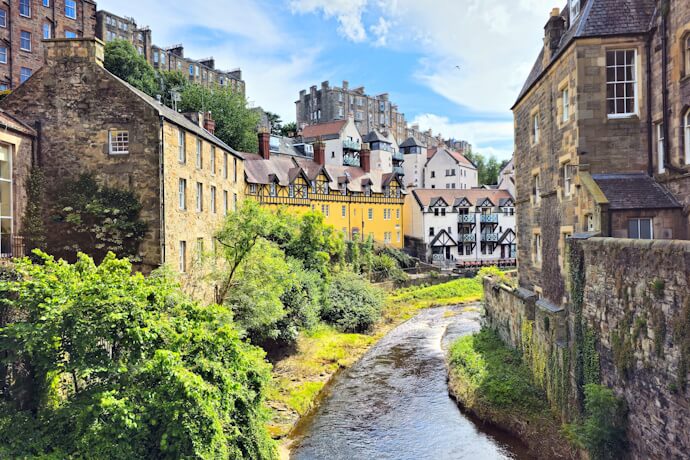 Dean Village in Edinburgh, Scotland, with charming stone houses along the Water of Leith