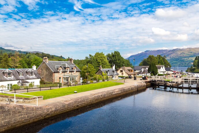 Fort Augustus on Loch Ness in the Scottish Highlands, featuring waterfront cottages and mountain views