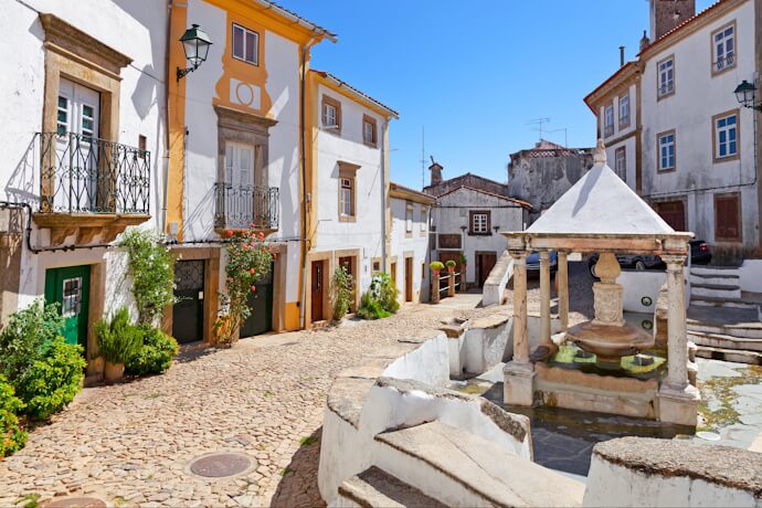 Small village street with historic whitewashed houses in Alentejo, Portugal