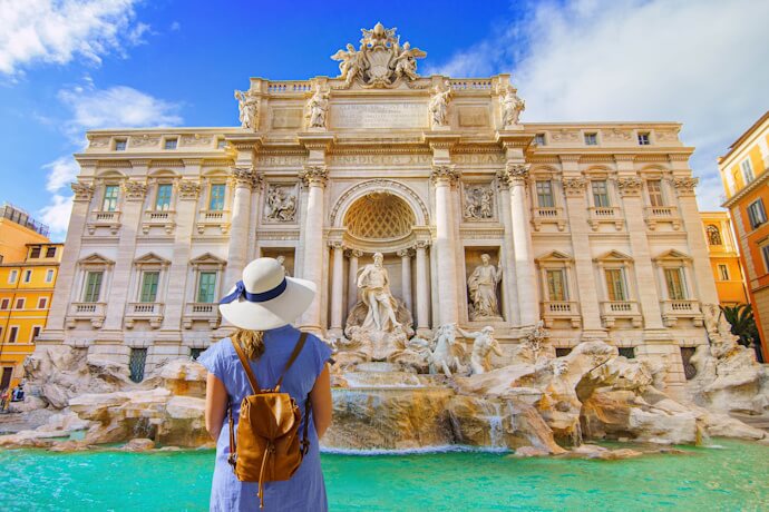 Woman admiring the Fontana di Trevi in Rome, Italy