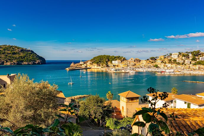 Mediterranean harbor with a hillside village in Mallorca, Spain