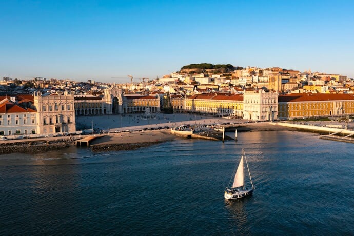 Lisbon’s Praça do Comércio and waterfront seen from the Tagus River.