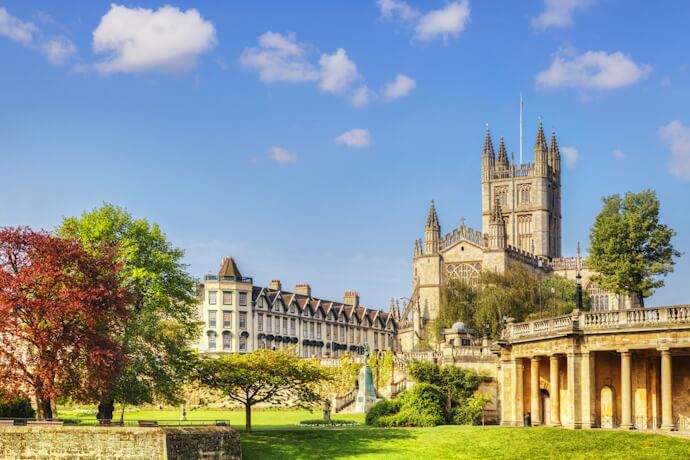 Bath Abbey overlooking the gardens in the historic city of Bath, England, showcasing Georgian architecture